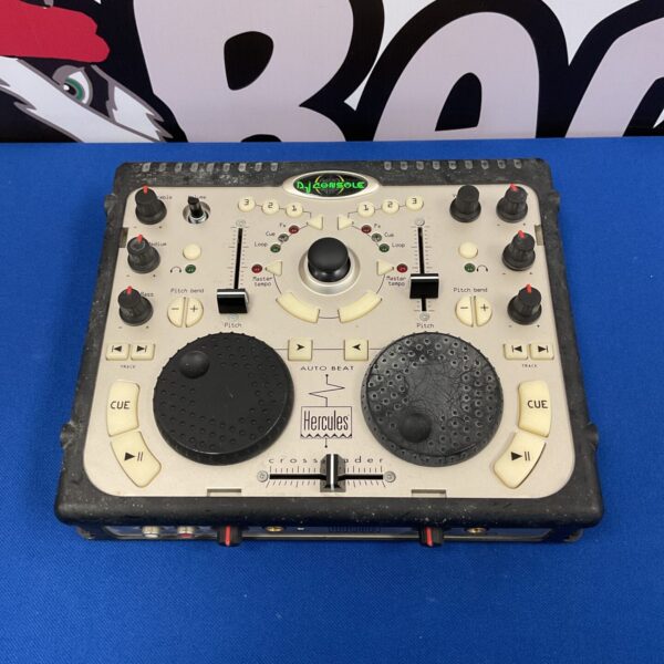 Front view of a used Hercules DJ controller with knobs and faders.