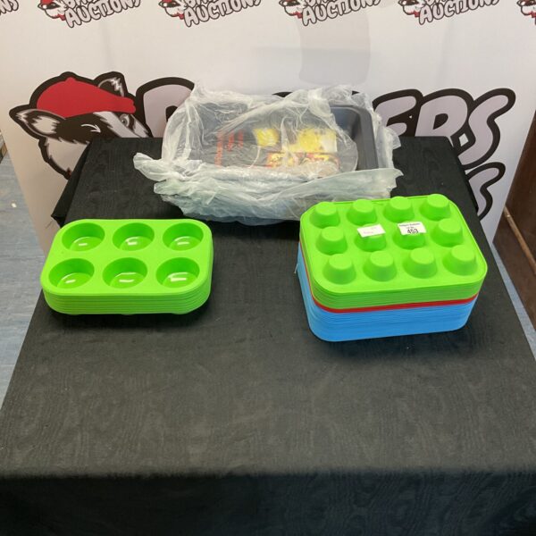 Stack of colourful silicone cupcake moulds for baking.