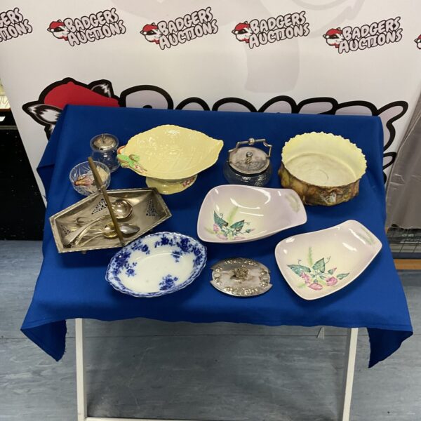 Vintage Carltonware dish and silver plate cutlery collection on display.