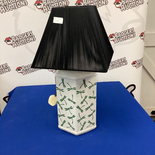 Vintage ceramic table lamp with dragonfly pattern for home decor.
