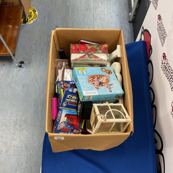 Mixed lot of toys and Christmas decorations in a cardboard box.