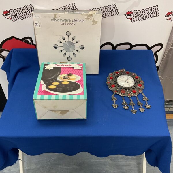 Mixed lot of kitchenware including a clock and cupcake maker.