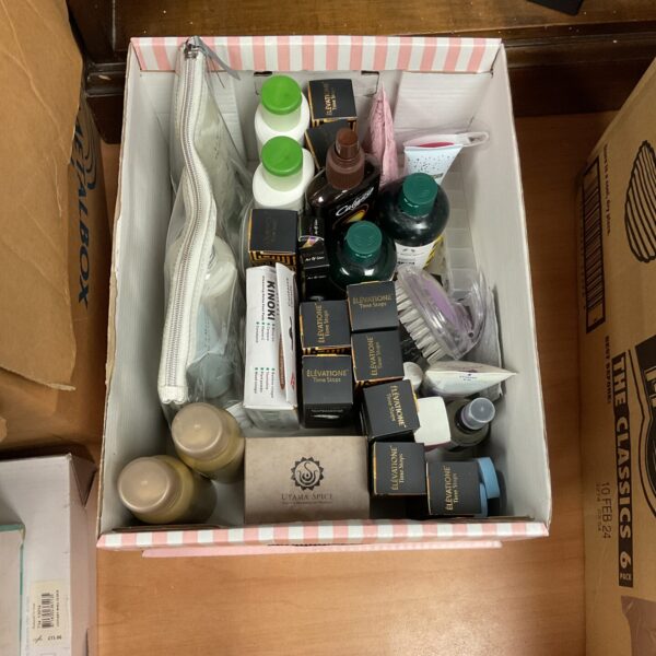 Mixed lot of cosmetic and makeup products, including art makeup and shampoo.