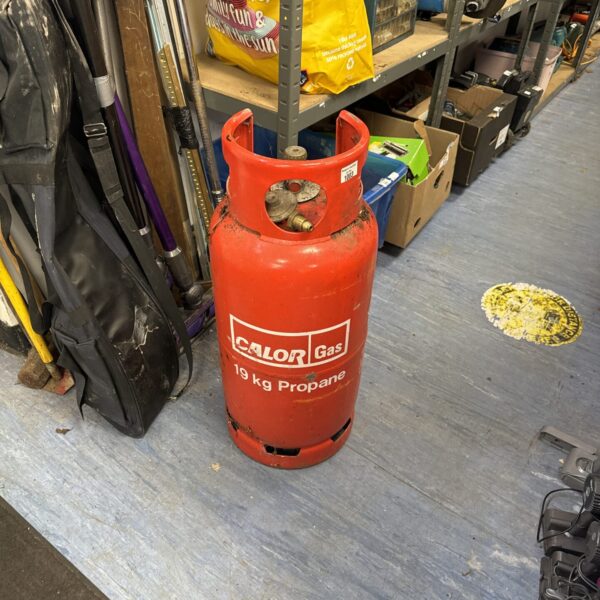 Red 19kg Calor gas bottle with regulator attached.