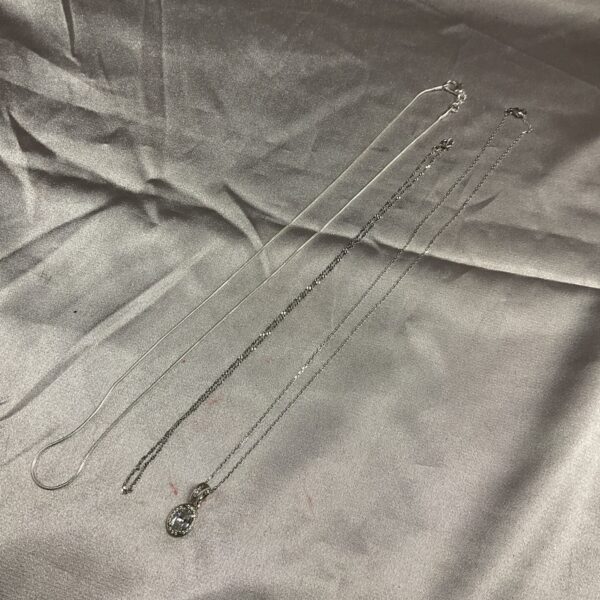 Silver necklace lot with white stone pendant.