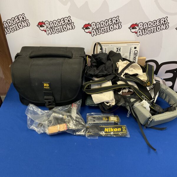 Large lot of camera accessories including a bag and filters.