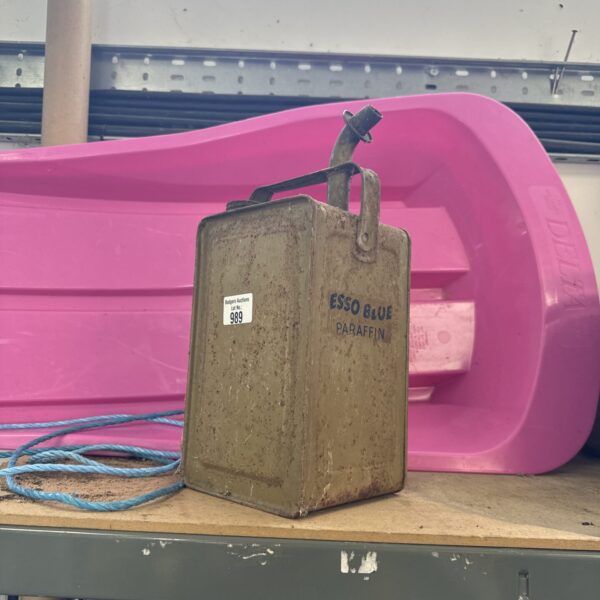 Vintage blue Esso paraffin can, a collectible fuel container.