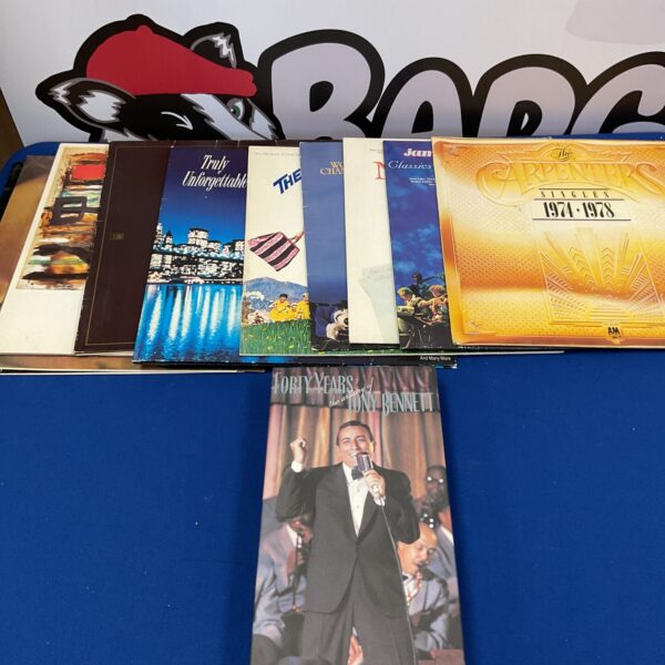 Vinyl record collection featuring The Carpenters and Tony Bennett albums.