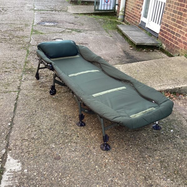 Green Nash Indulgence Mk4 fishing bed, folded and ready for use.
