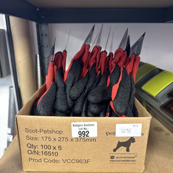 Box of new size M work gloves for hand protection.
