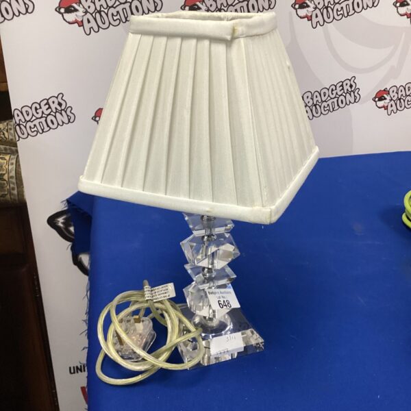 Vintage glass table lamp with cream shade for home decor.