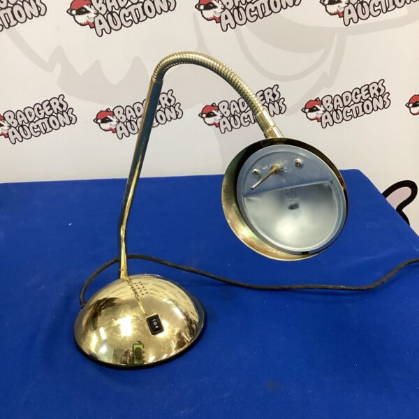 Vintage brass table lamp with adjustable head.