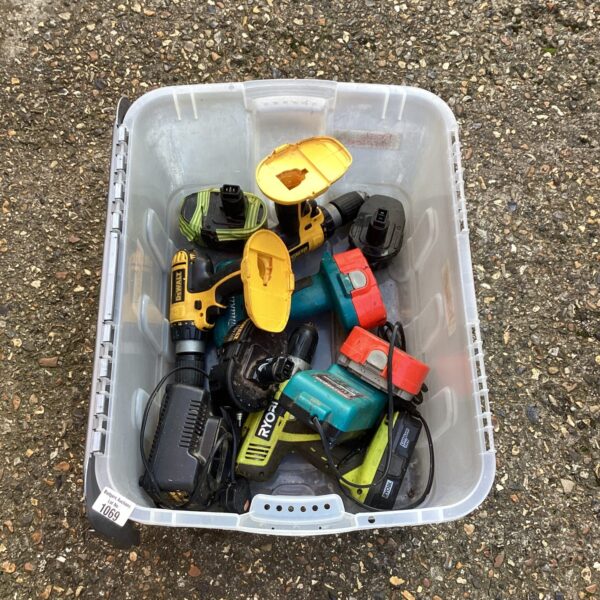 A box of Dewalt and other cordless drills for repair.