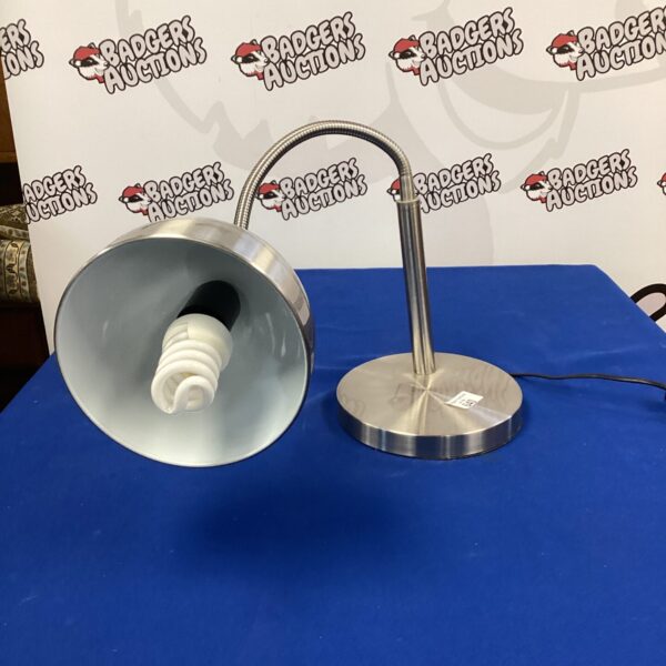 Modern stainless steel adjustable table lamp for desk or reading.