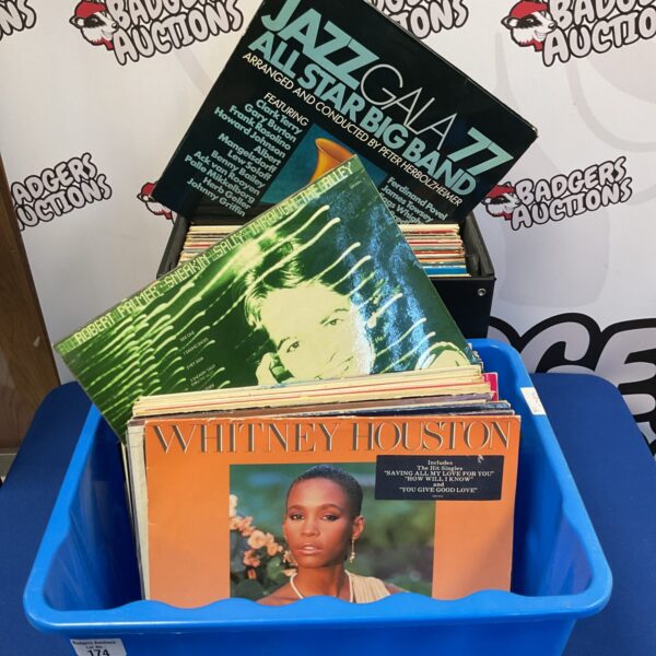 Vinyl record lot featuring Whitney Houston and Jenny Darren records.