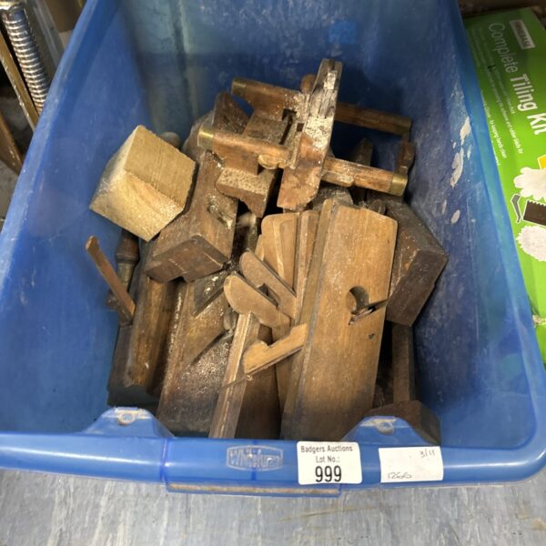 Vintage woodworking tools lot with planes and chisels.