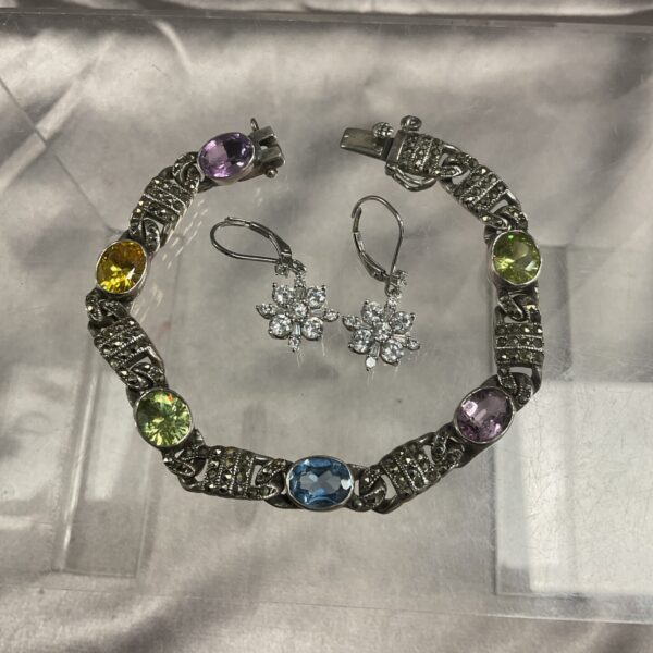 Silver bracelet set with multicolour stones, vibrant fashion jewellery.