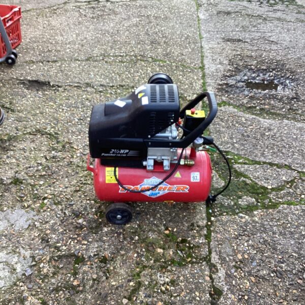 Clarke Panther air compressor in a garage setting.