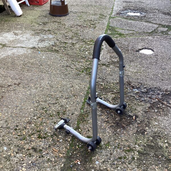 Rear view of a used motorcycle stand for bike maintenance.
