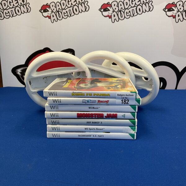 Nintendo Wii games lot with steering wheel accessories for sale.