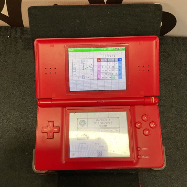 Red Nintendo DS console with Who Wants to Be a Millionaire game cartridge.
