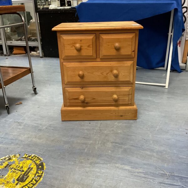 Small pine bedside cabinet with drawer and cupboard.