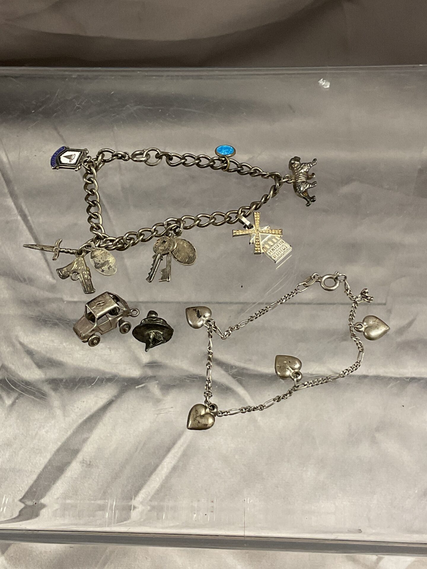 843 two silver charm bracelets 24g