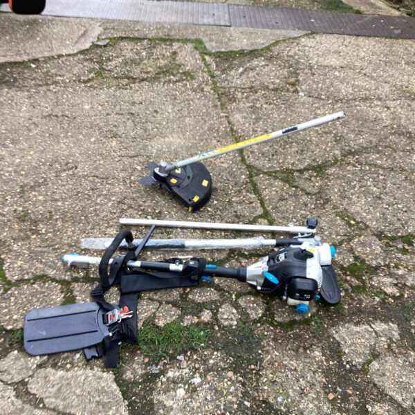 Mac Allister garden multi tool with grass trimmer head attached.