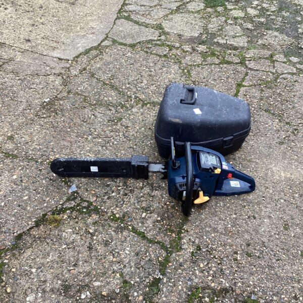 Front view of a performance petrol chainsaw for garden use.