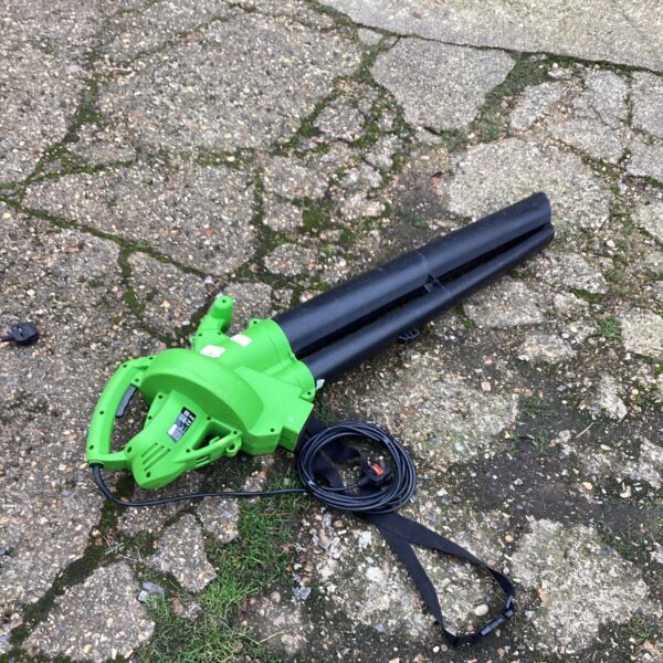 Electric leaf blower for garden cleaning and leaf removal.