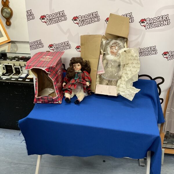 Ashton Drake and Leonardo Collection dolls in original box.