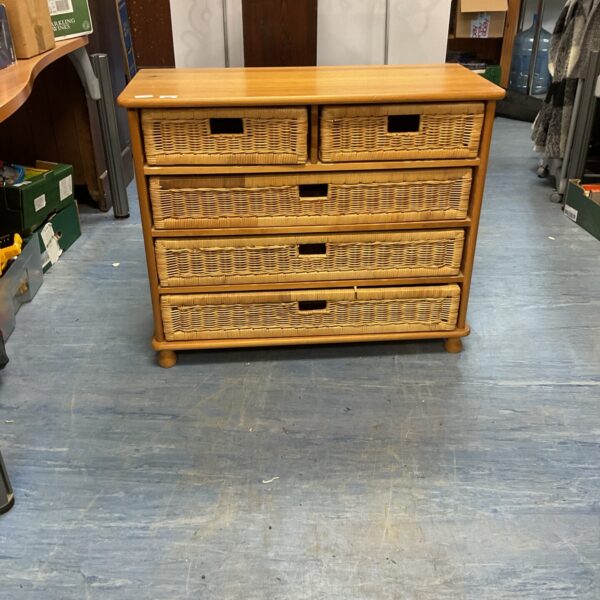 Rustic wicker draw unit with beach style aesthetic.