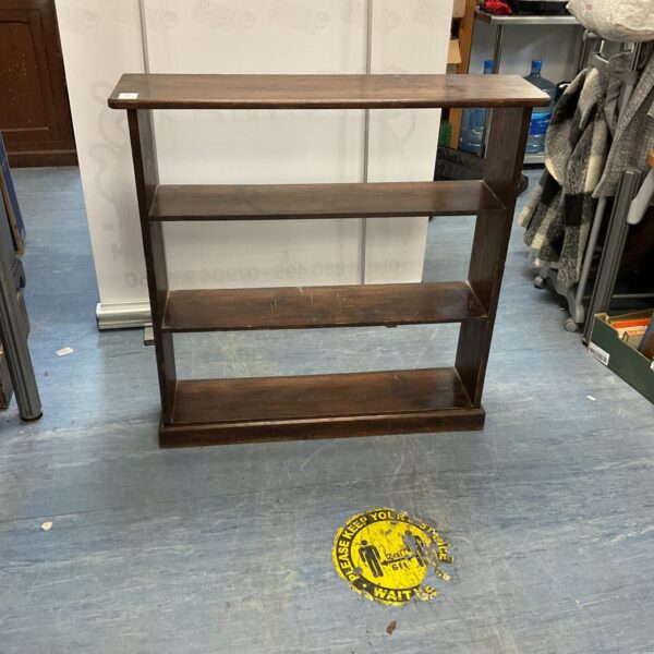 Small wooden four-tier bookshelf for books and display items.