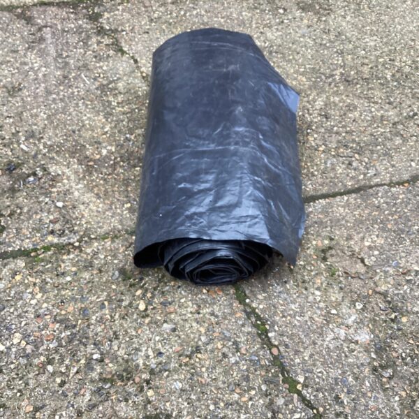 Roll of heavy-duty polythene sheeting for construction and DIY.