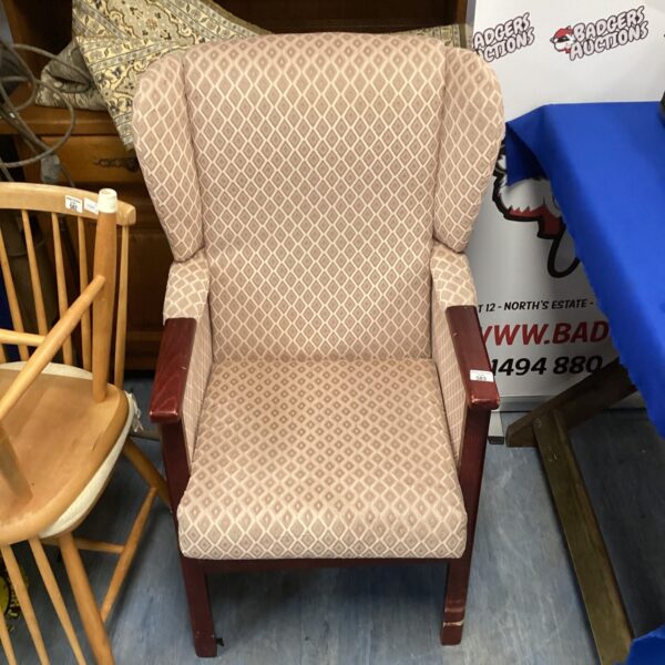 Vintage diamond pattern armchair with wood frame.