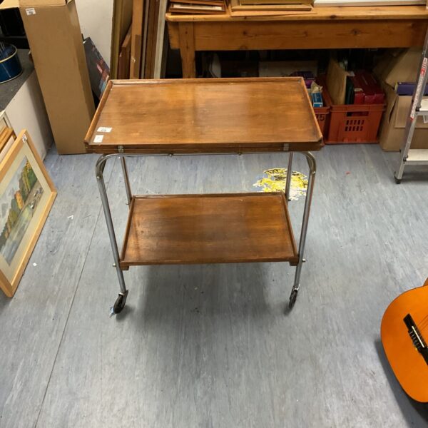 Vintage butlers trolley with swivel top and wooden tiers.
