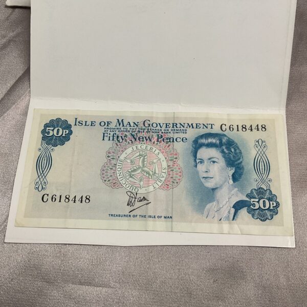 Front of a vintage Isle of Man 50p banknote featuring Queen Elizabeth II.