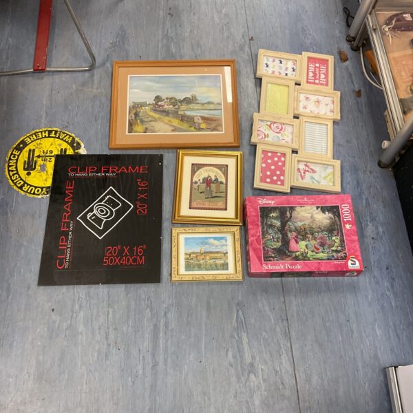 Mixed lot of framed pictures and a Disney puzzle for sale.
