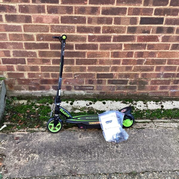 Side view of a blue and black Razor electric scooter.