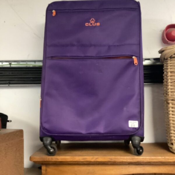 Front view of a vintage purple Club rolling suitcase.