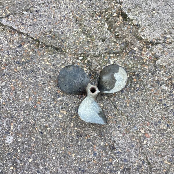 Vintage propeller blade for boat restoration or nautical display.
