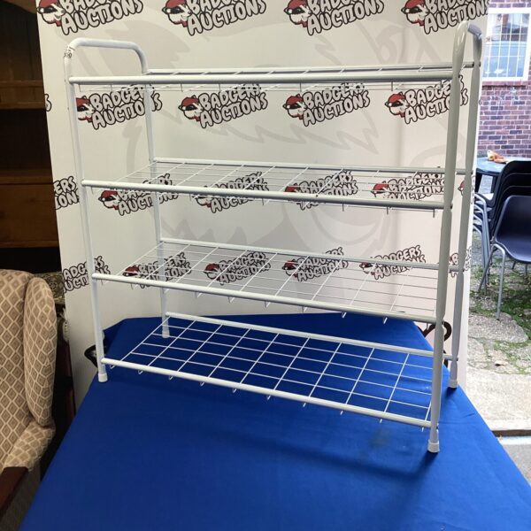 Multi-tiered metal wire shoe rack for organised storage.