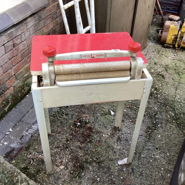 Vintage Fleetwood Products washing mangle in red and wood.