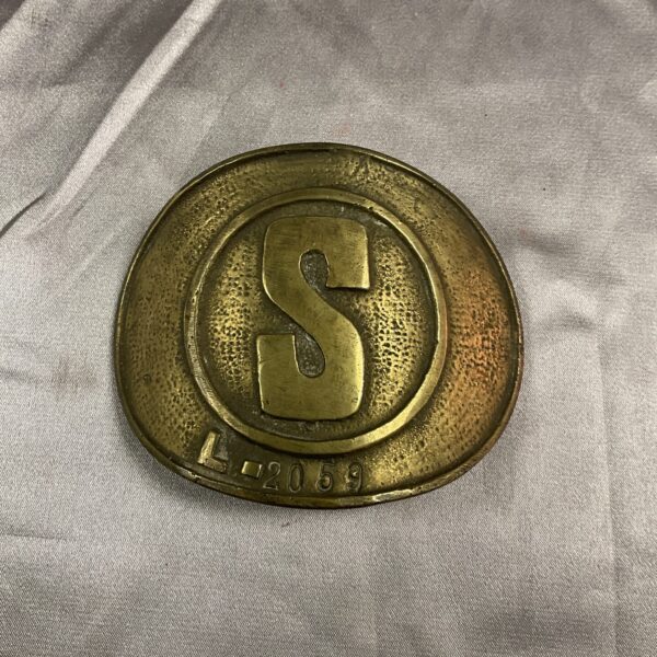 Front view of Cyprus British Colony brass arm badge with "S" emblem.