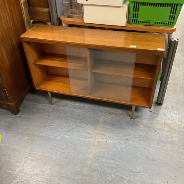 Vintage teak display cabinet with glass front and tapered legs.