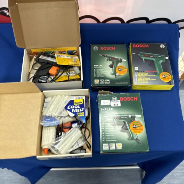 Assortment of glue guns including a Bosch PKP 18 electric hot glue gun.