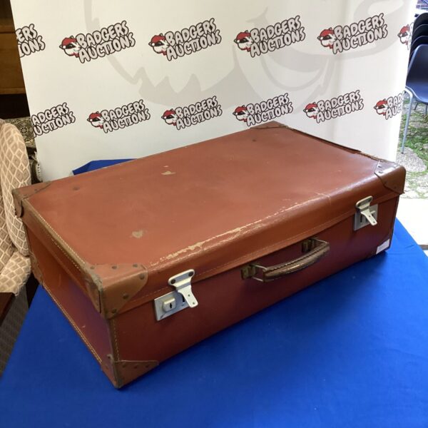 Brown vintage leather suitcase, classic travel luggage.
