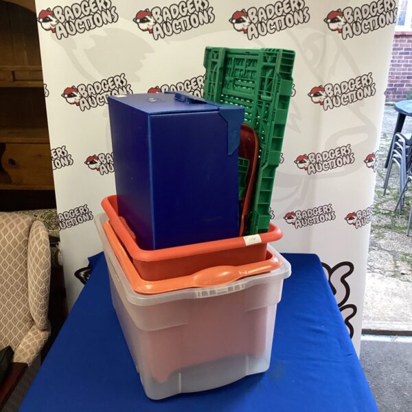 Red and blue plastic storage boxes for household organisation.
