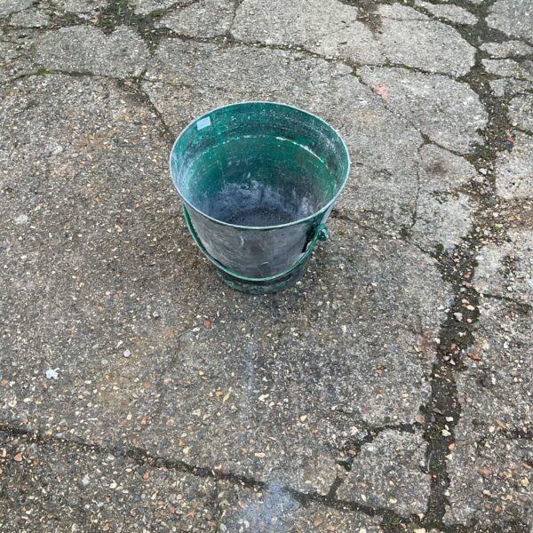 Vintage galvanised fire bucket with signs of age.
