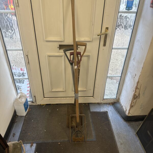 Vintage garden tool set including spade, fork, hoe and edging tool.